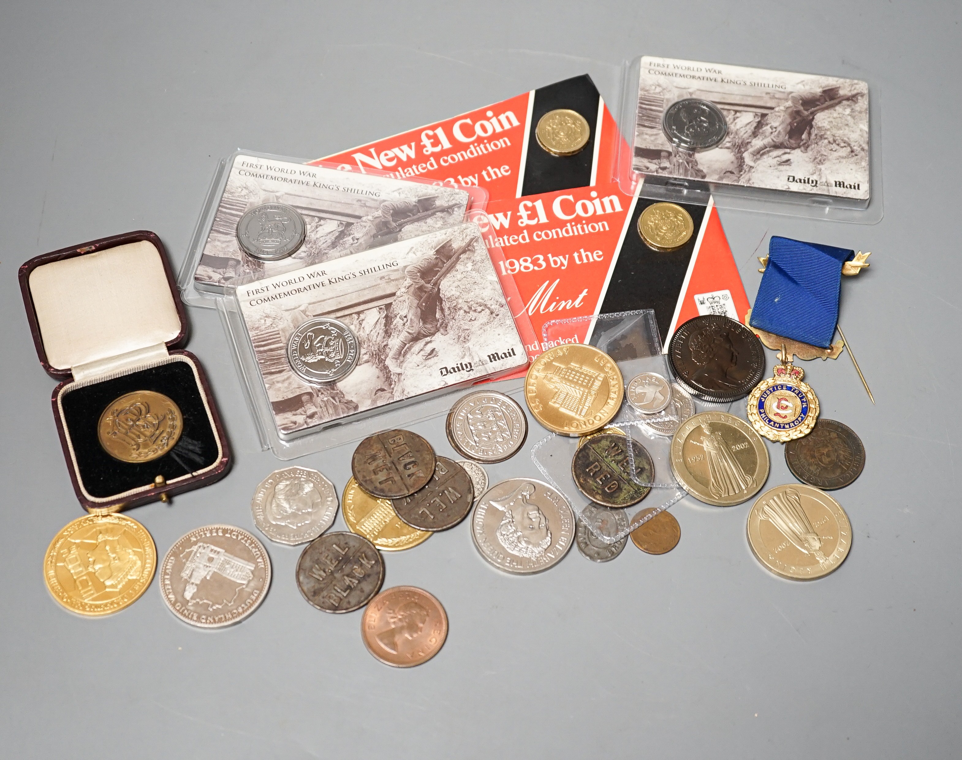 A collection of military badges and a collection of coins